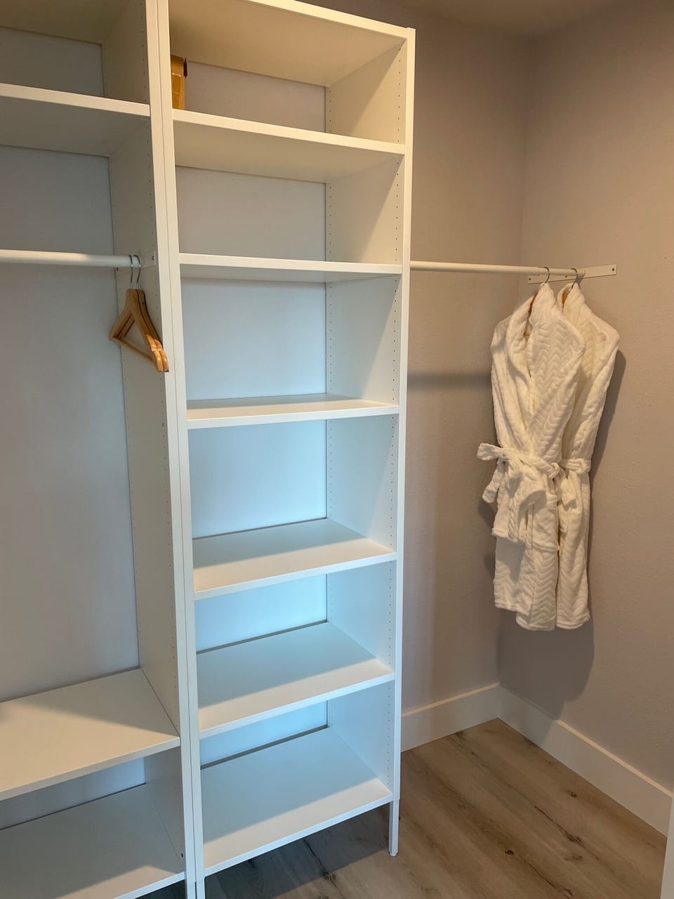 Walk-in closet with spa robes for guests to enjoy. 