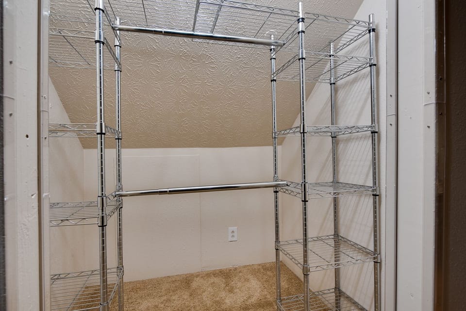 Walk In Closet with lots of hanging and storage space
