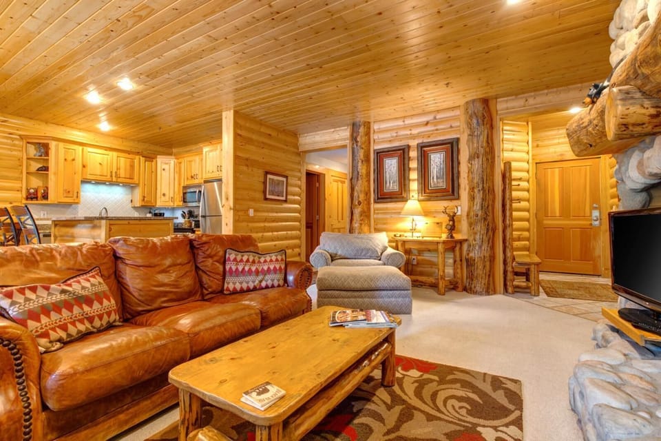 Fireside lounging with leather seating and a warm, inviting layout perfect for après-ski evenings.
