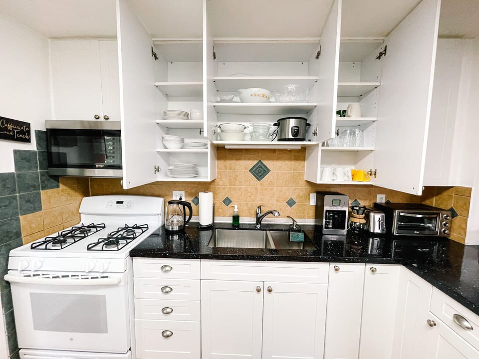 Our fully stocked kitchen has it all—dishes, utensils, pots, rice maker, microwave, toaster, oven, coffee makers, and more! Missing something? Just let us know!