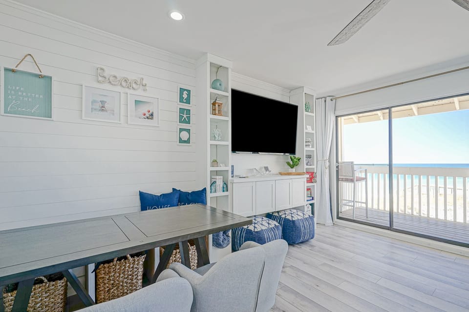 Extra storage under dining built-in bench. Fun beach decor on built-in.