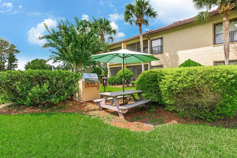 Wander shaded walkways bordered by lush gardens and open lawns.