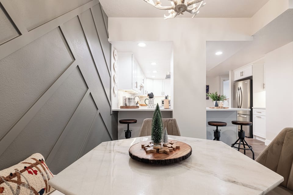 Dining table detail with open kitchen view