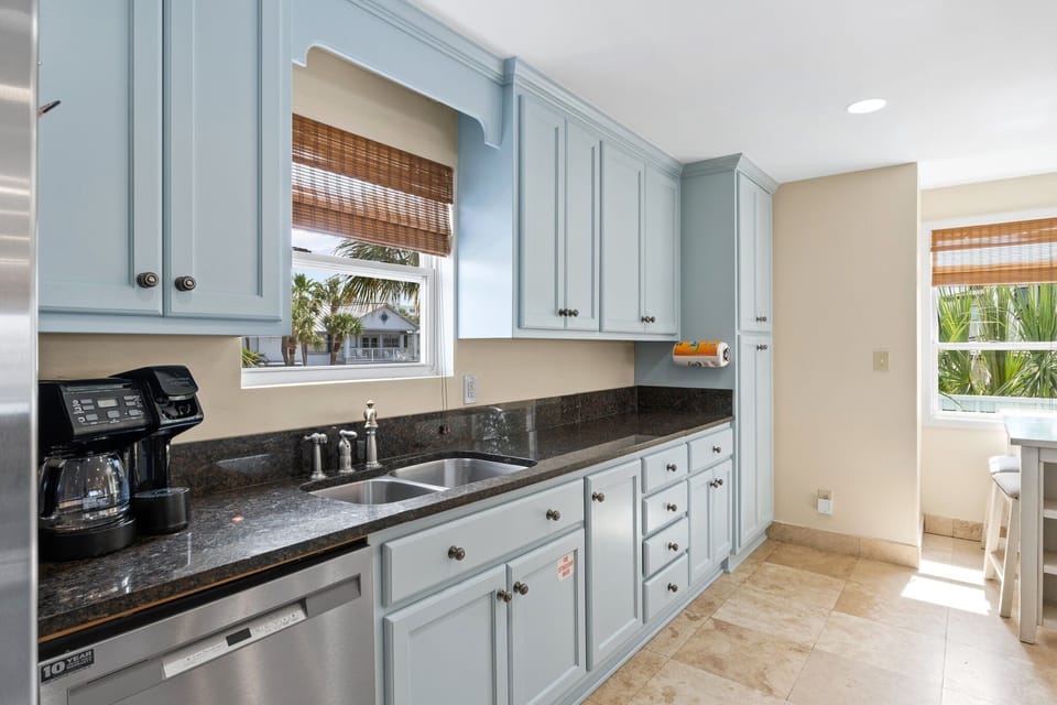 Enjoy cooking in a bright, fully stocked kitchen featuring stainless steel appliances, granite countertops, and breathtaking canal views right from the breakfast bar.

Professionally Managed By 
Breathe Easy Rentals