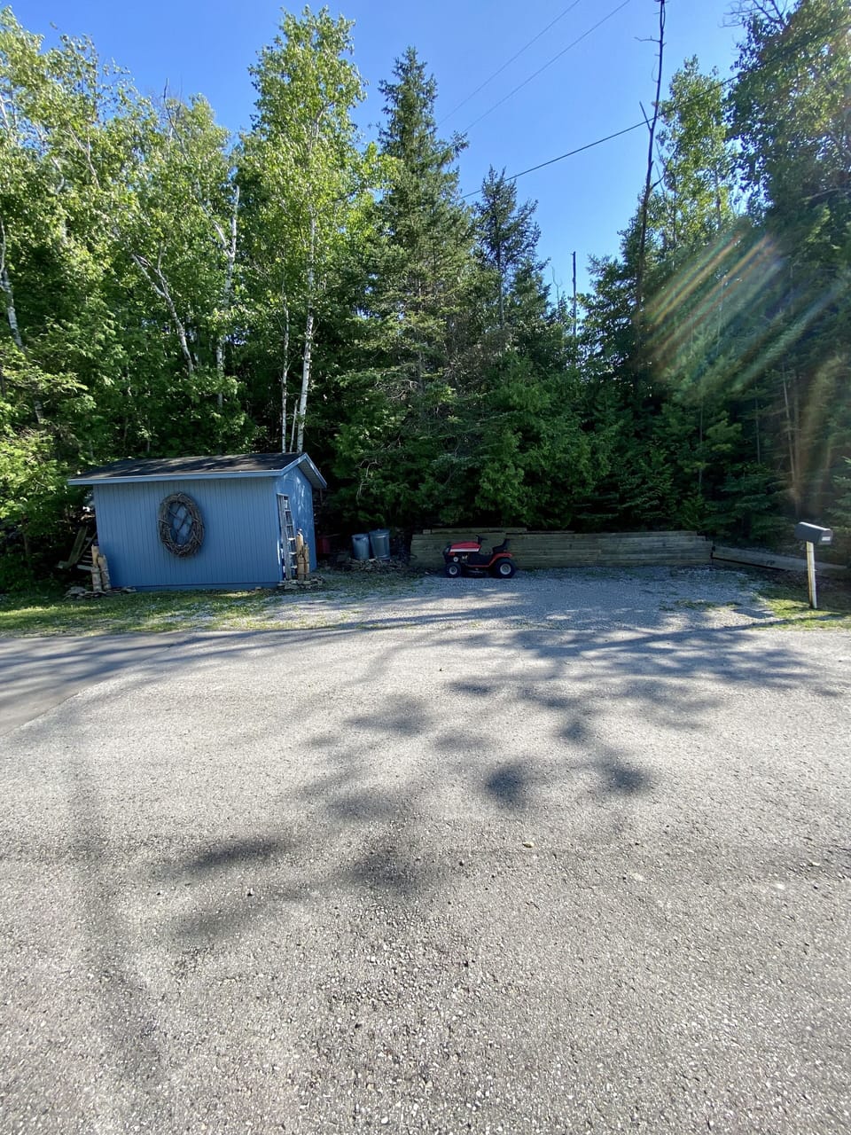 Parking in front of house plus this extra parking area.