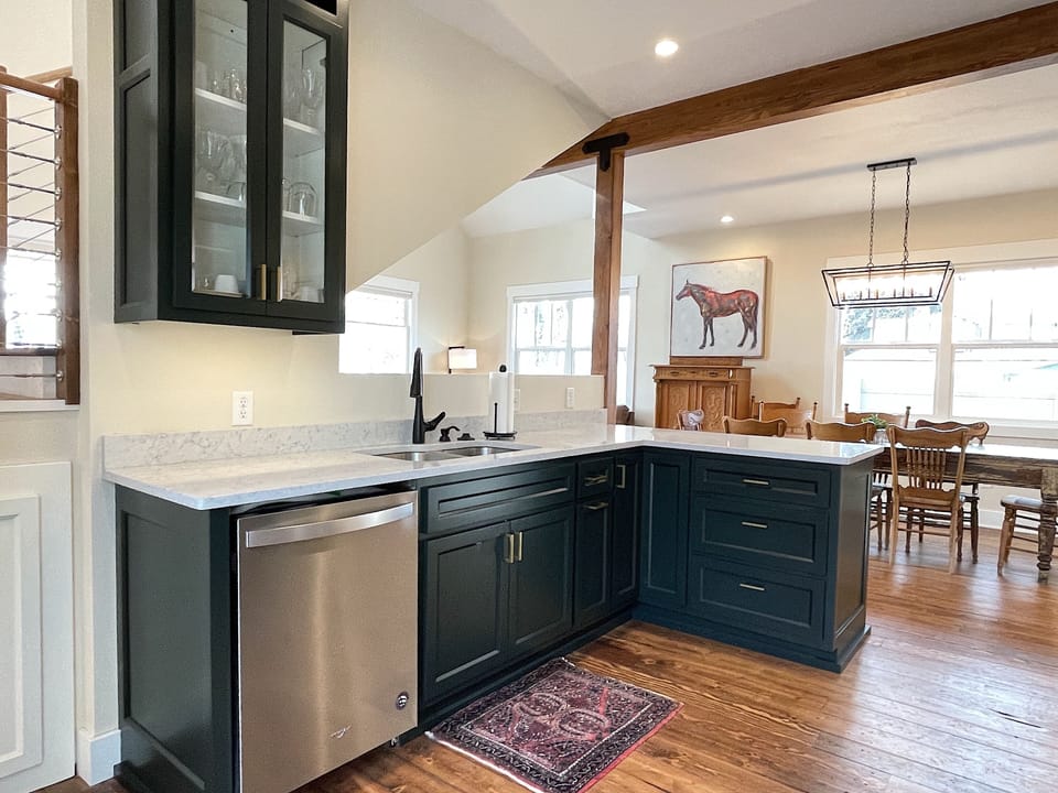 The custom kitchen with modern appliances is well-equipped for your group meals