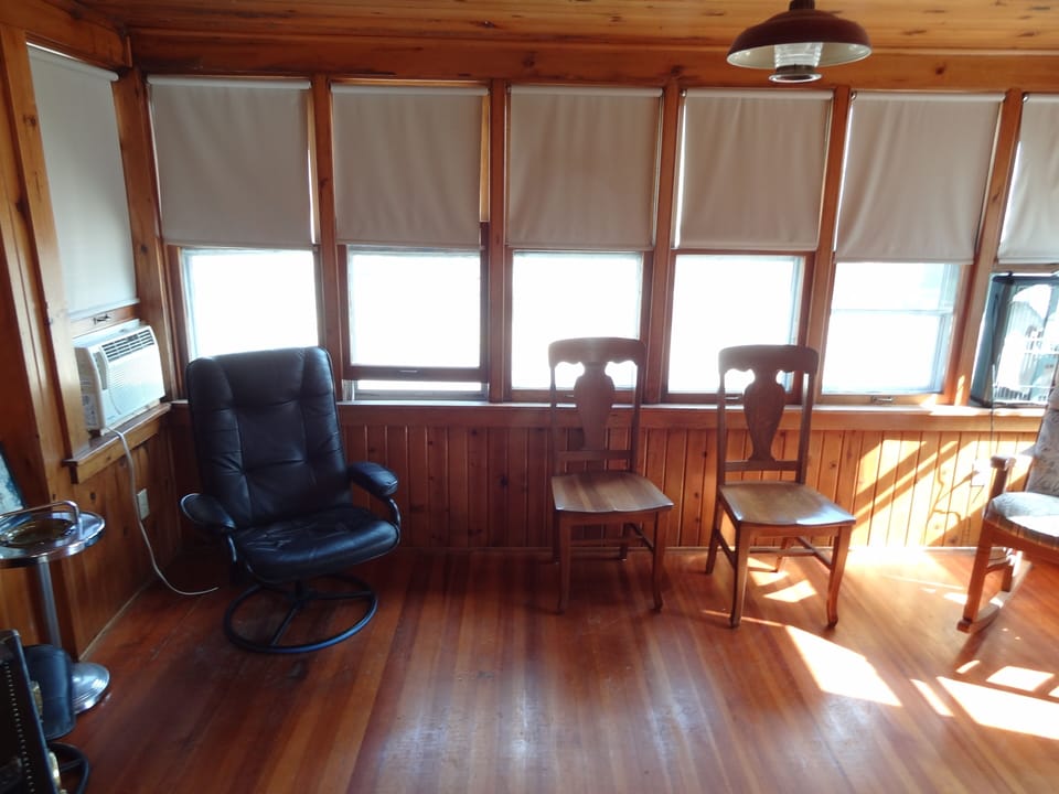 Beautiful wooden sun porch OK for a blow up mattress.