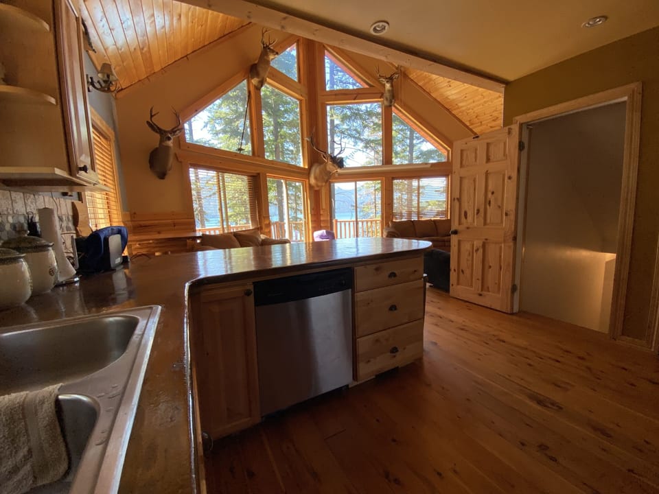 Kitchen and island with hard wood floors 
