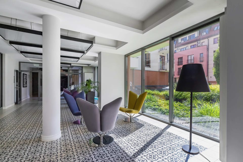 A sleek entry area with modern decor, neutral tones, and a welcoming atmosphere.