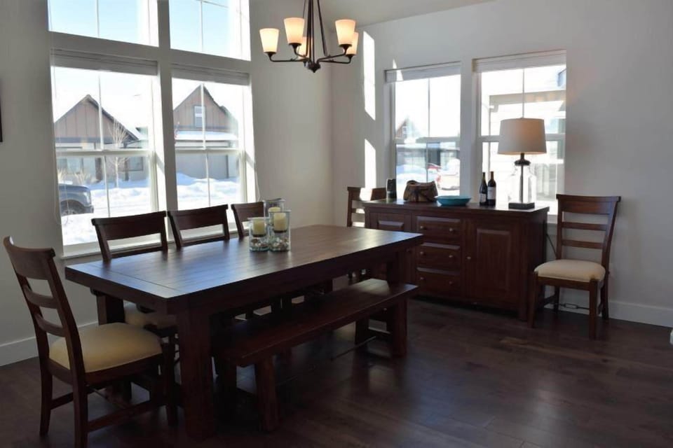 The dining room table can seat up to seven guests.