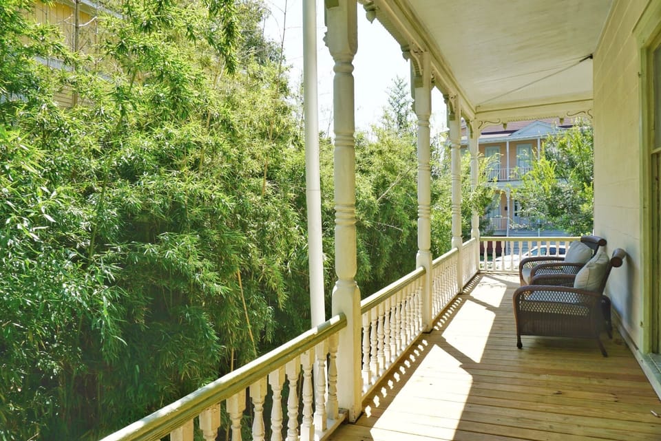This apartment features a furnished porch balcony overlooking the courtyard.