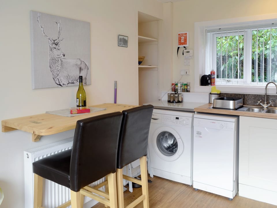 Useful breakfast bar in kitchen | Elm Bank, Lochcarron, near Wester Ross