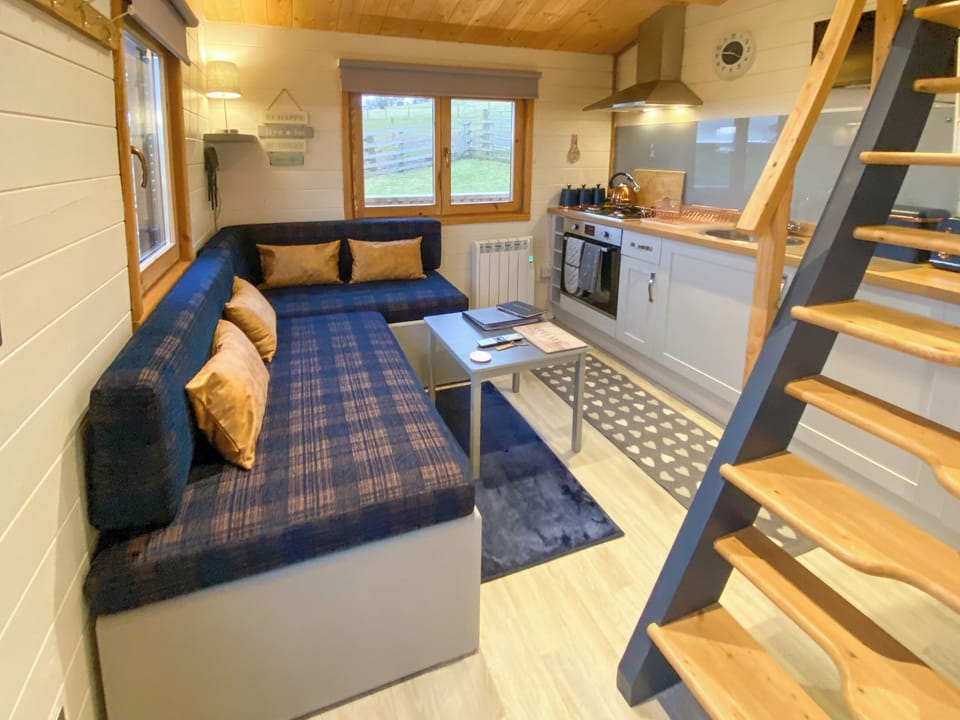 Kitchen area with stairs to mezzanine | The Nab, Pockley, near Helmsley