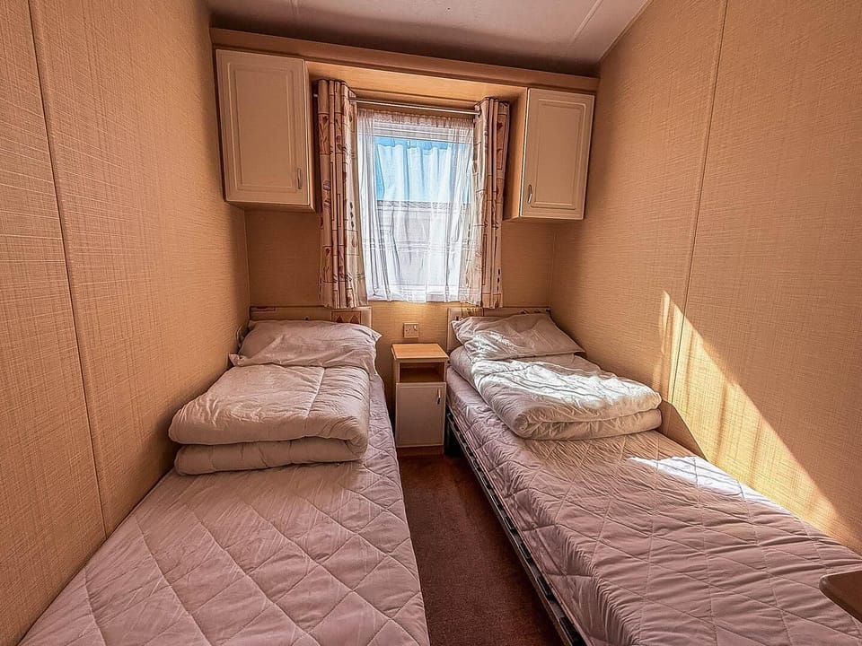The thoughtful layout of the twin room provides a snug and functional area to rest and recharge after a day on the Lowestoft beach.