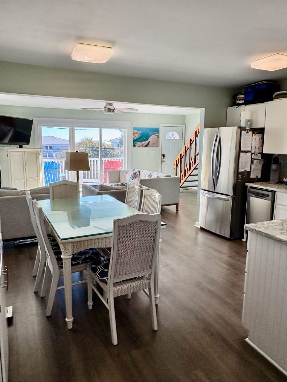 Large Dining table w/ 6 chairs. Additional folding chairs & card table provided.