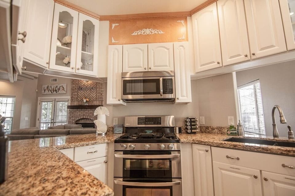 Fully stocked kitchen with all appliances and utensils 