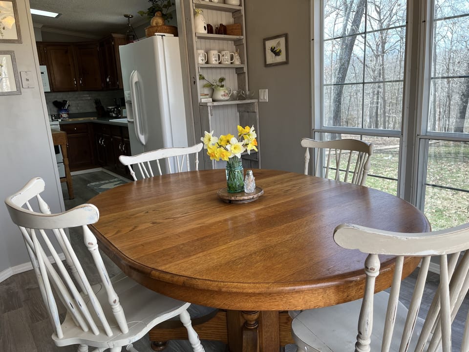 Breakfast room surrounded by windows.  Bringing nature right up close.