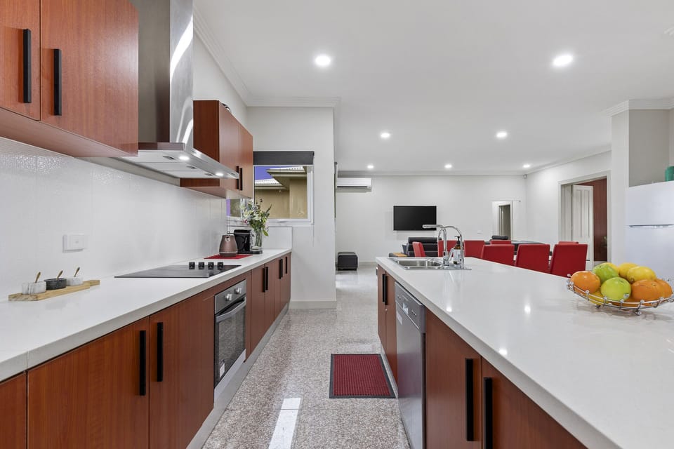 Open Plan Dining and Kitchen Areas with access to backyard