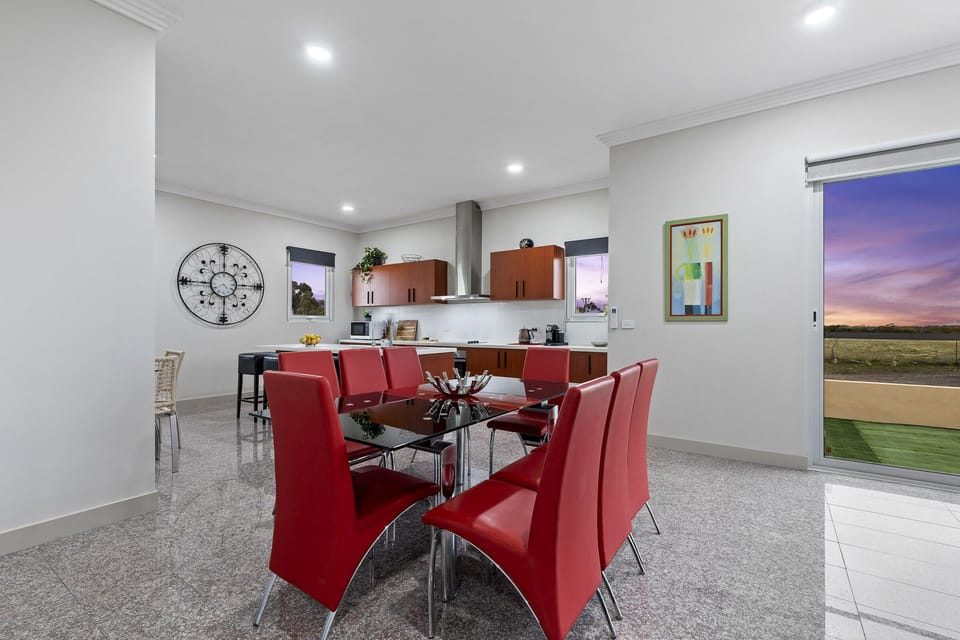 Open Plan Dining and Kitchen Areas with access to backyard