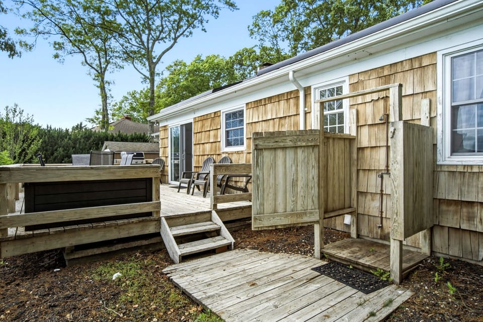 Outdoor shower with cedar enclosure off the deck