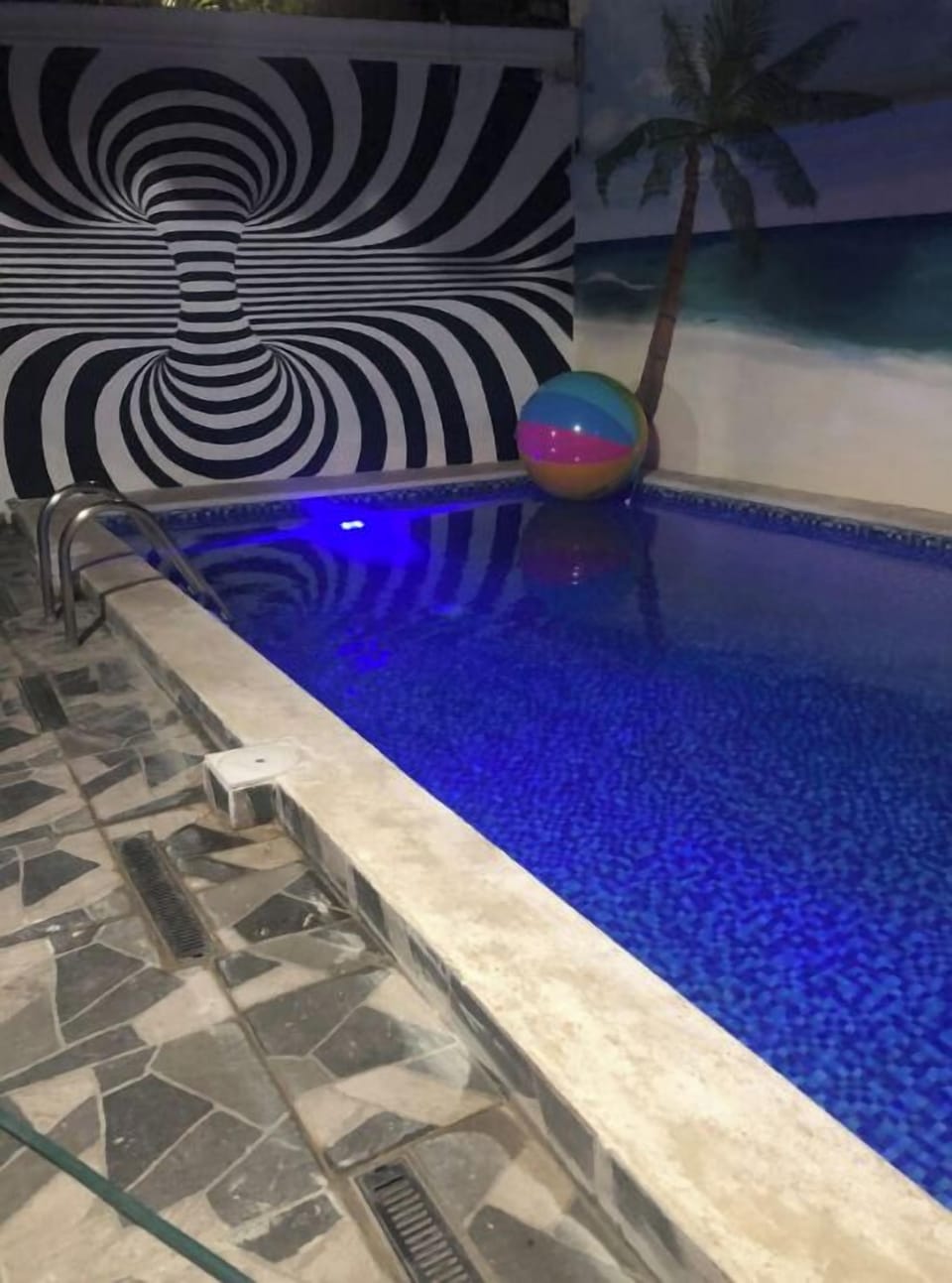Evening VIew of Pool/Multi Color lights and 3D Mural to enjoy
