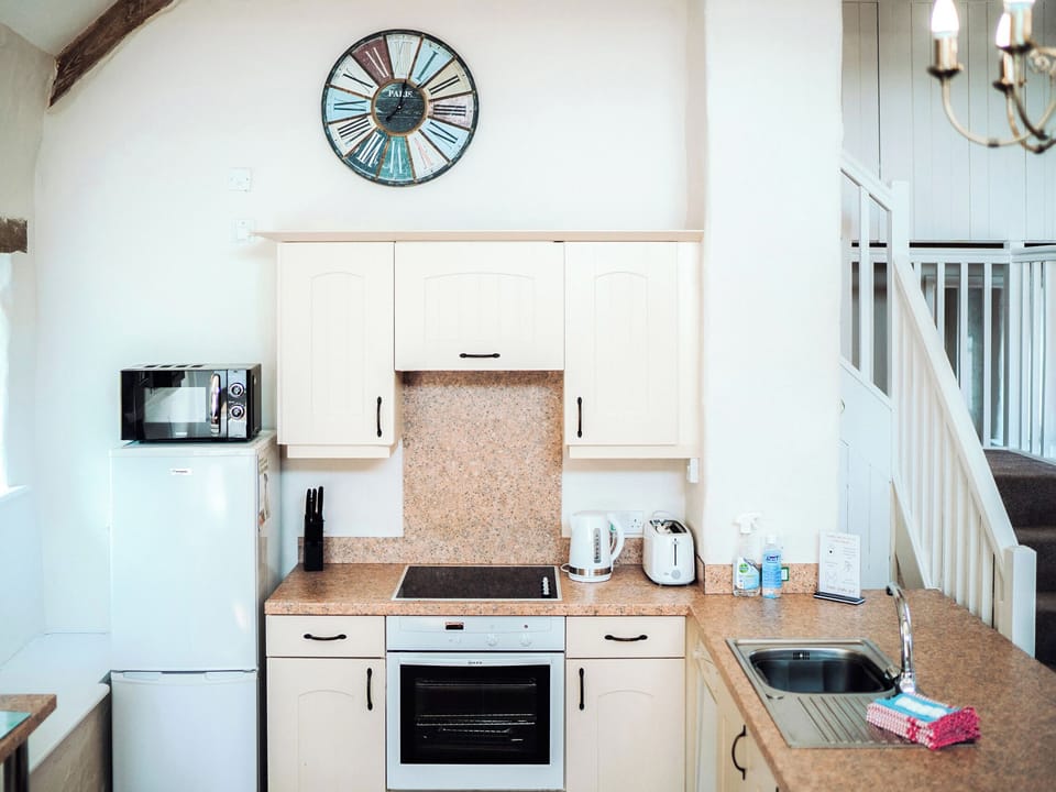 Kitchen area | Flemish Cottage - Celtic Haven Resort, Lydstep, near Tenby