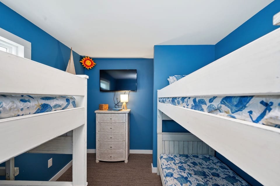 Bunk room- 4 twin beds and television. 