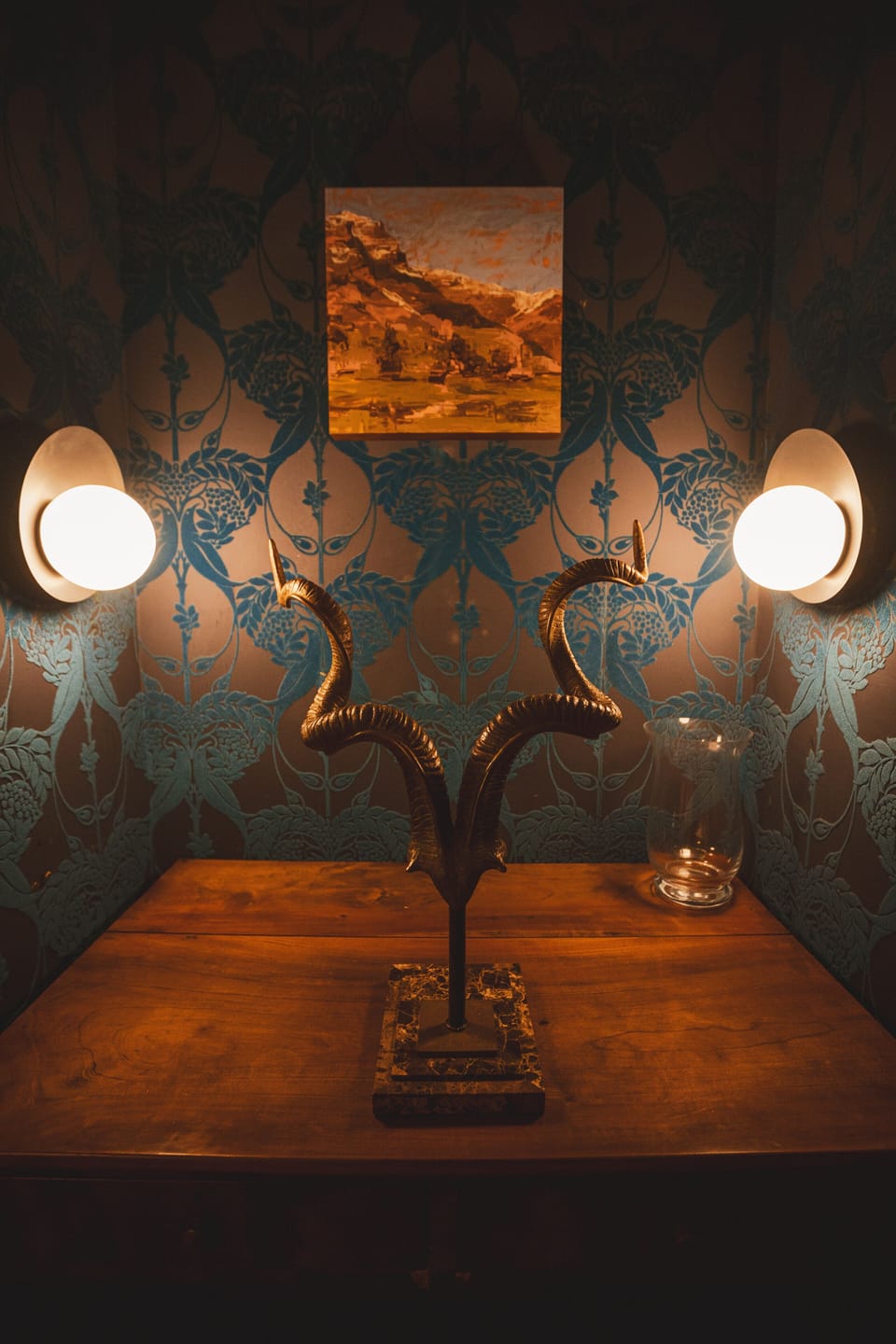 A cozy corner with funky velvet wallcovering.