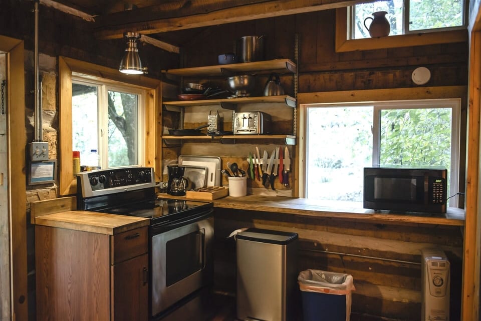 A full sized stove with glass cooktop
