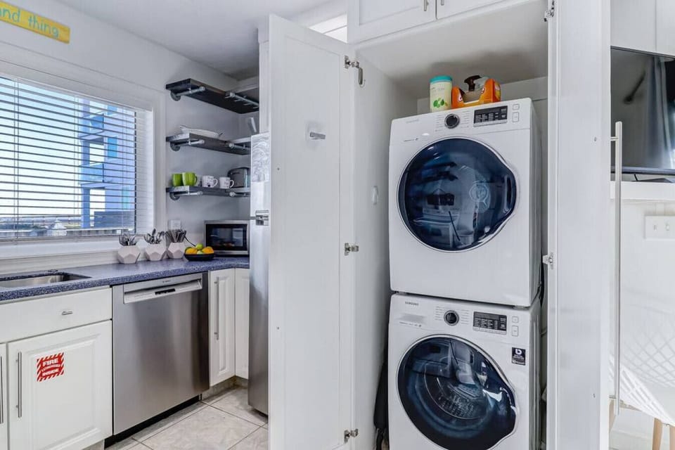Washer and dryer/ kitchen area