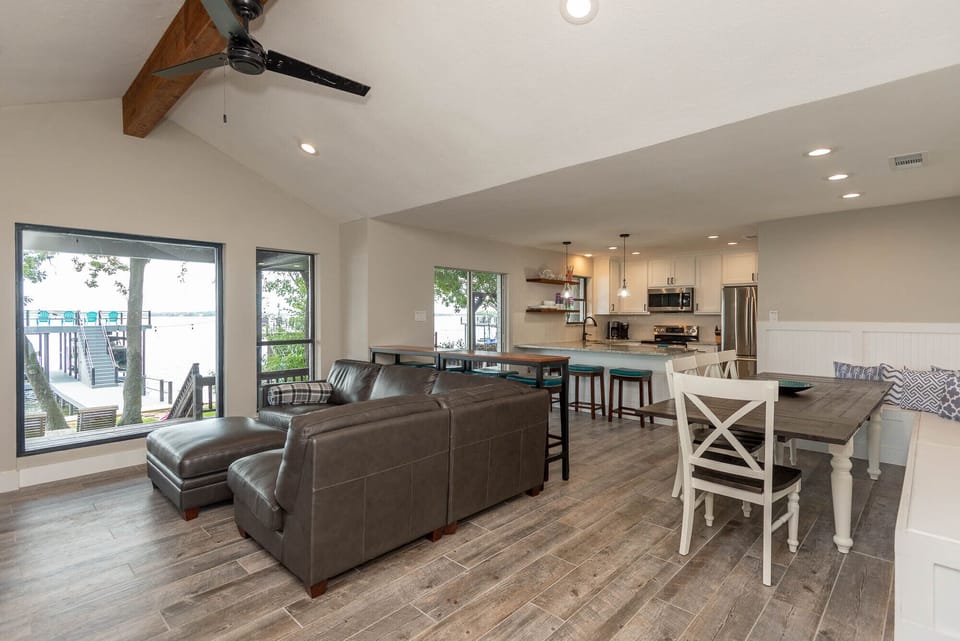 Living and dining combination in the great room opens to the updated kitchen.