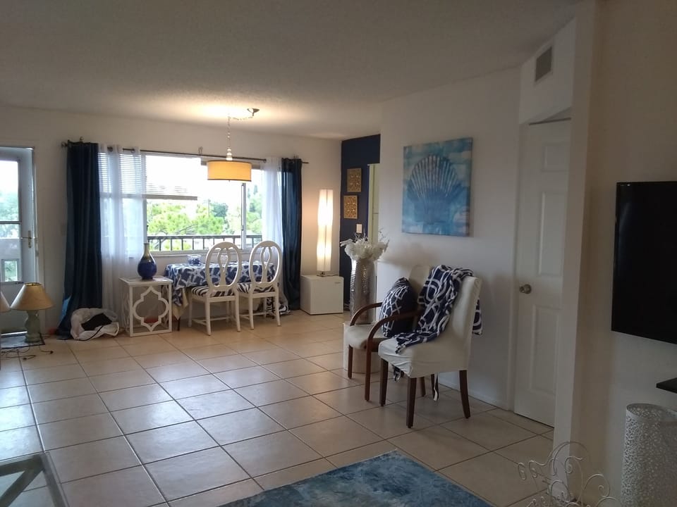 Looking from couch to front door and kitchen.