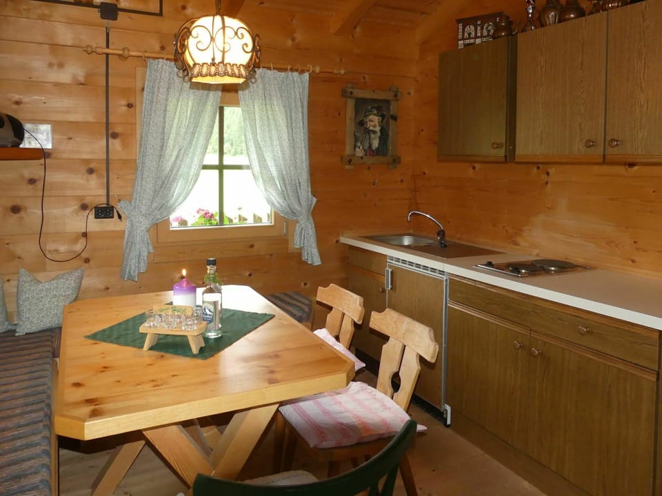 Property, Table, Furniture, Cabinetry, Countertop, Wood, Lighting, Interior Design, Window, Chair