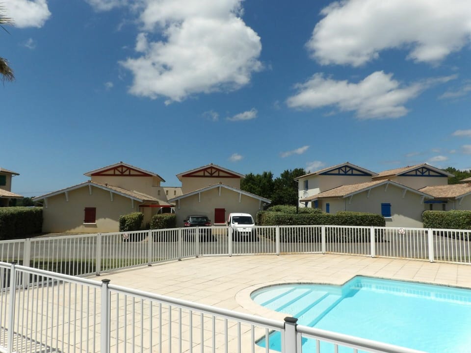 Sky, Cloud, Building, Property, Azure, Fence, Tree, Shade, Swimming Pool, House