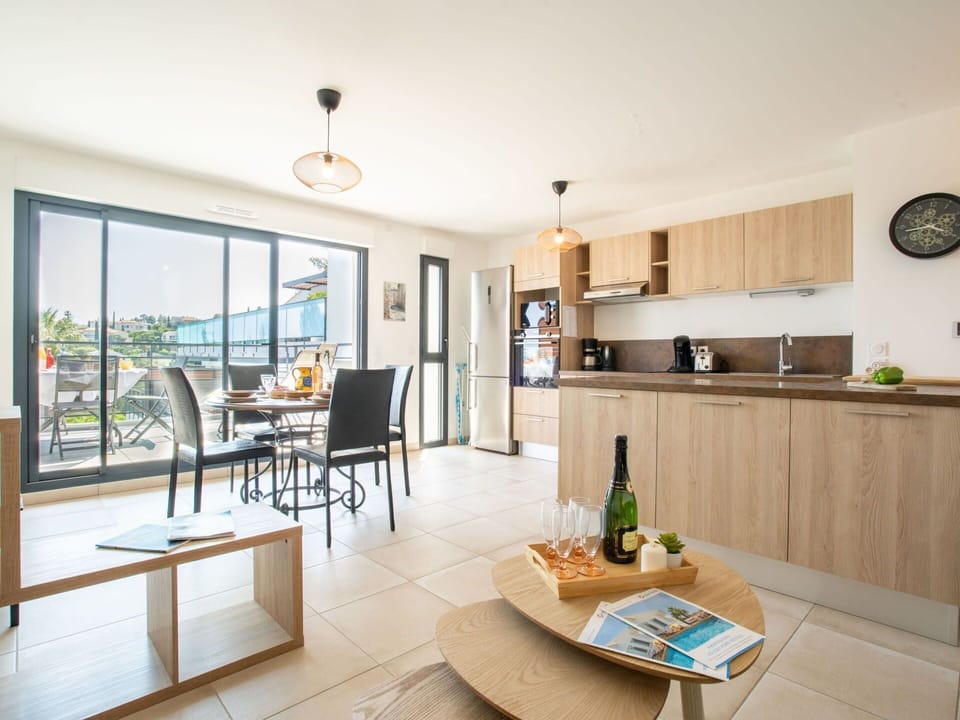 Cabinetry, Wood, Countertop, Table, Kitchen, Interior Design, Clock, Flooring, Floor, Bottle