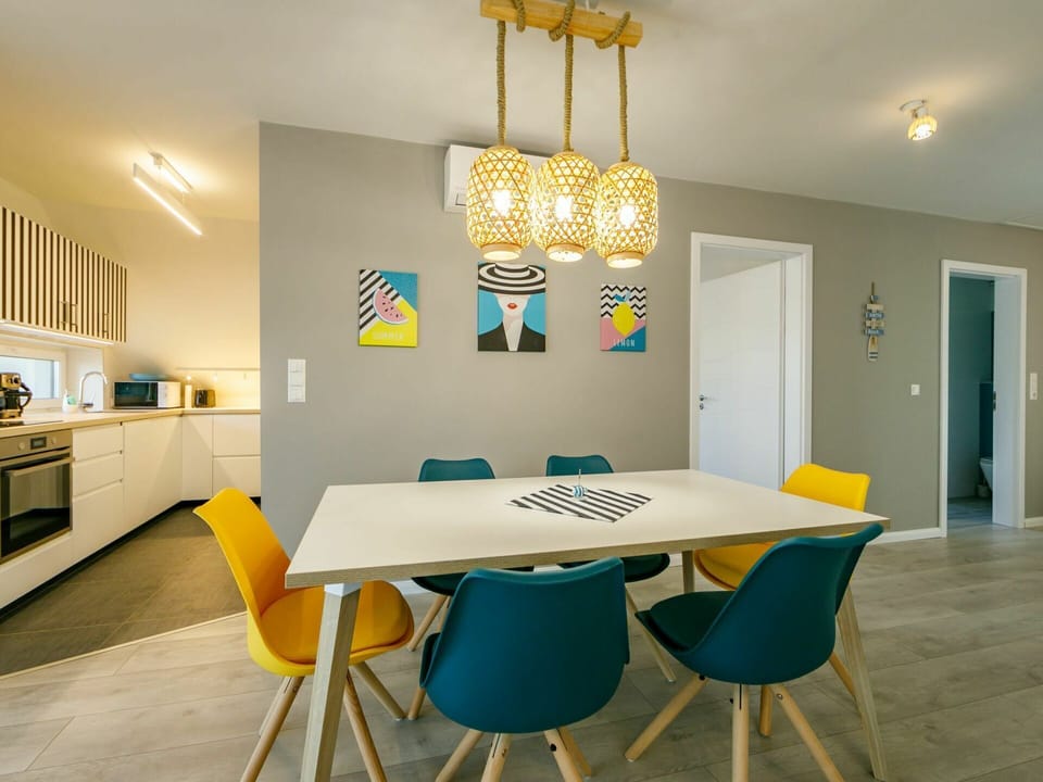Table, Furniture, Property, Light, Wood, Lighting, Interior Design, Cabinetry, Chair, Yellow
