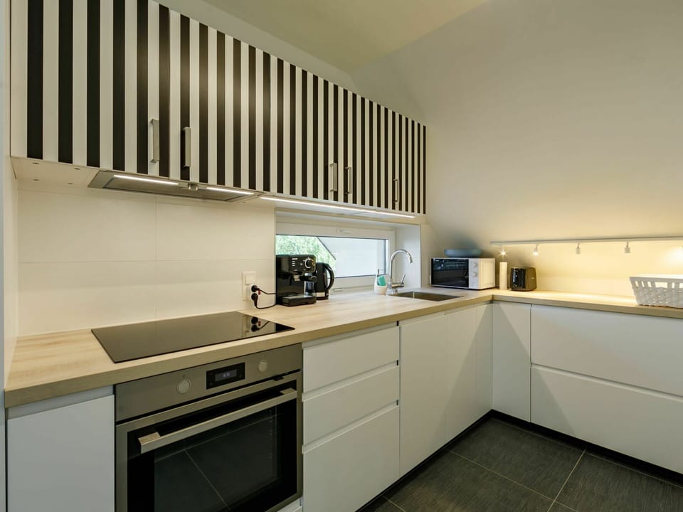 Cabinetry, Countertop, Property, Kitchen Appliance, Home Appliance, Kitchen Stove, Kitchen, Wood, Lighting, Interior Design