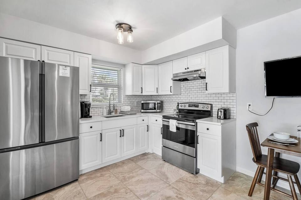 The cozy eat in kitchen is the perfect spot for enjoying a quiet meal or a quick cup of coffee. 