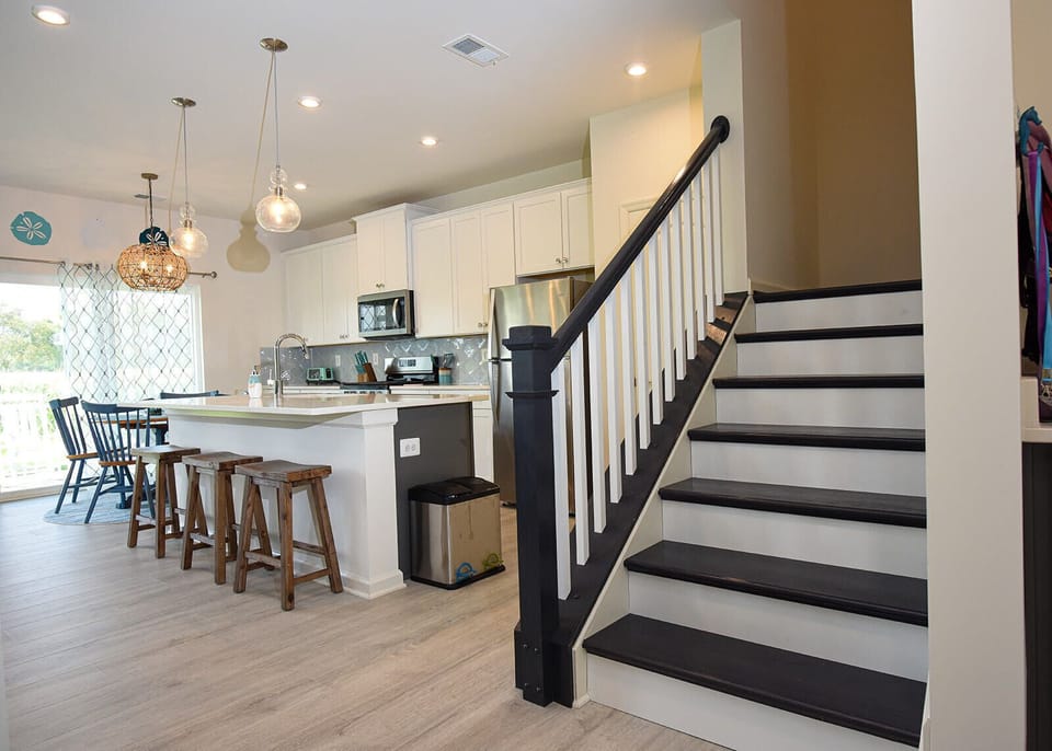 Kitchen island and stair to the upstairs space