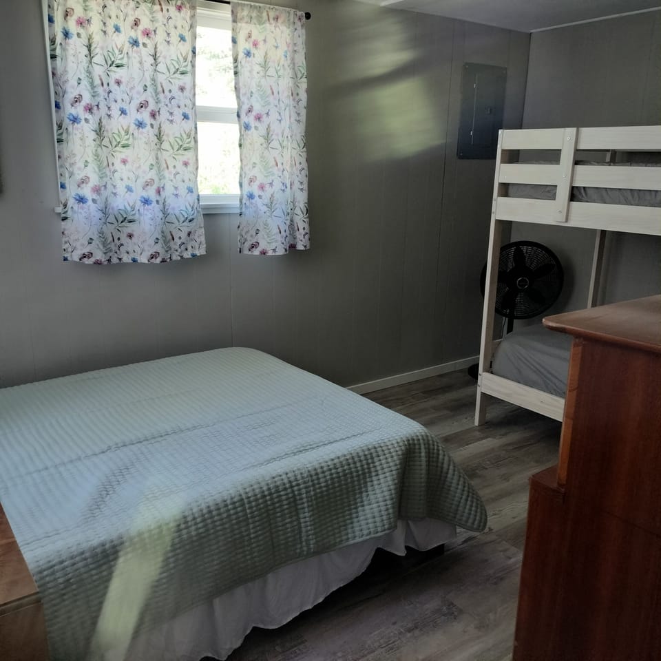 bedroom with full bed and twin bunk