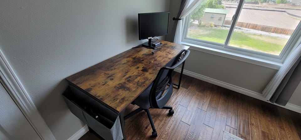 Desk, additional screen, and HDMI in Main bedroom