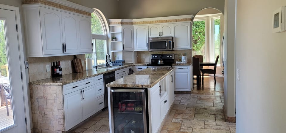 Kitchen with wine fridge and ample counter space
