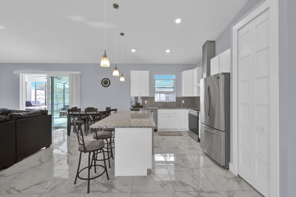 Fully stocked kitchen with Stainless Steel appliances.
