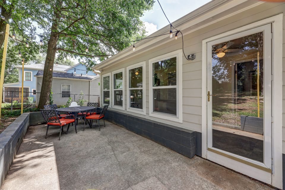 Full patio with string lights and furniture for outdoor dining