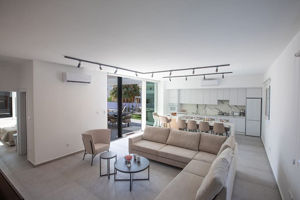 Living room with comfortable corner sofa and widescreen Smart TV