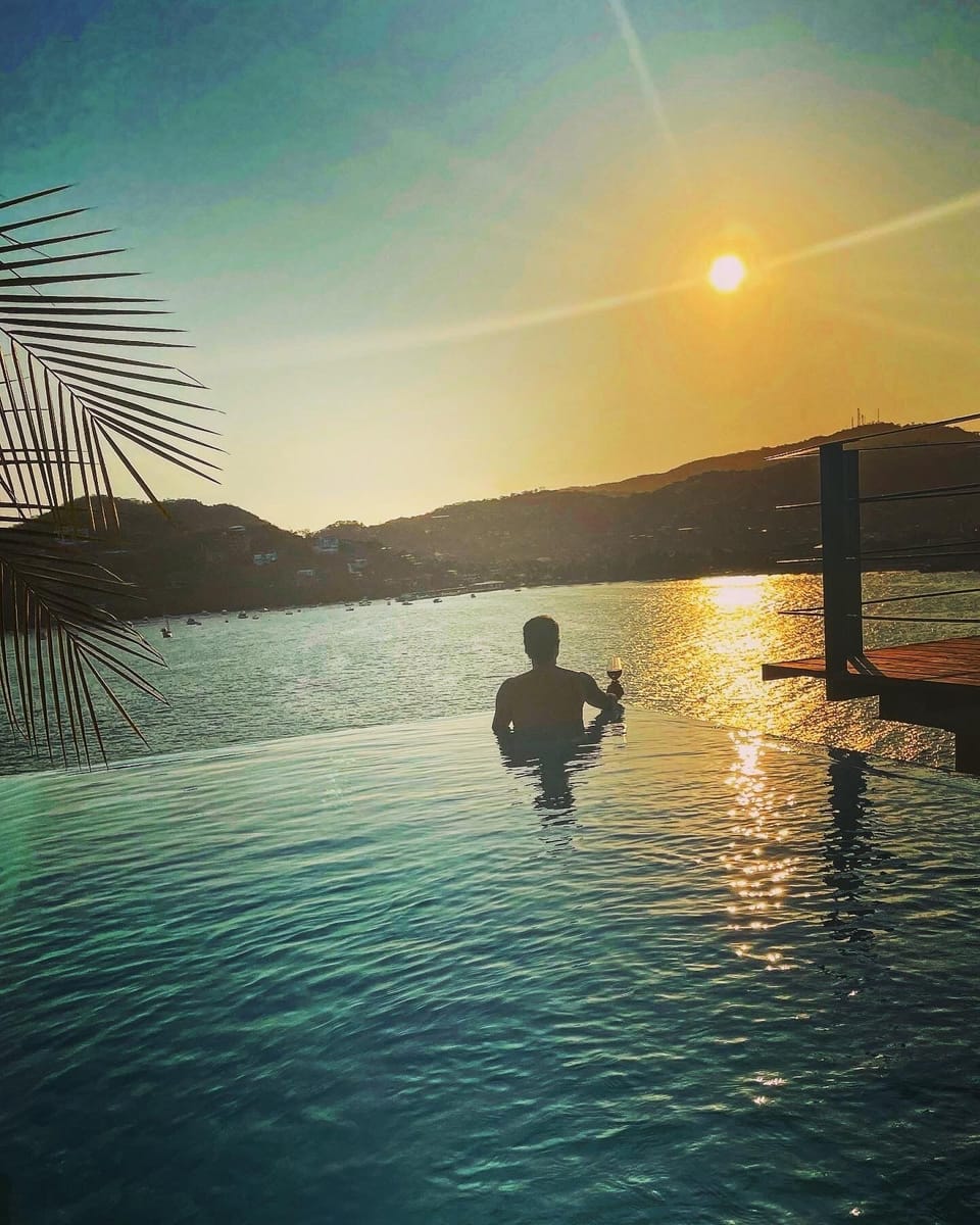 Sunset from infinity pool at El Nido. 
