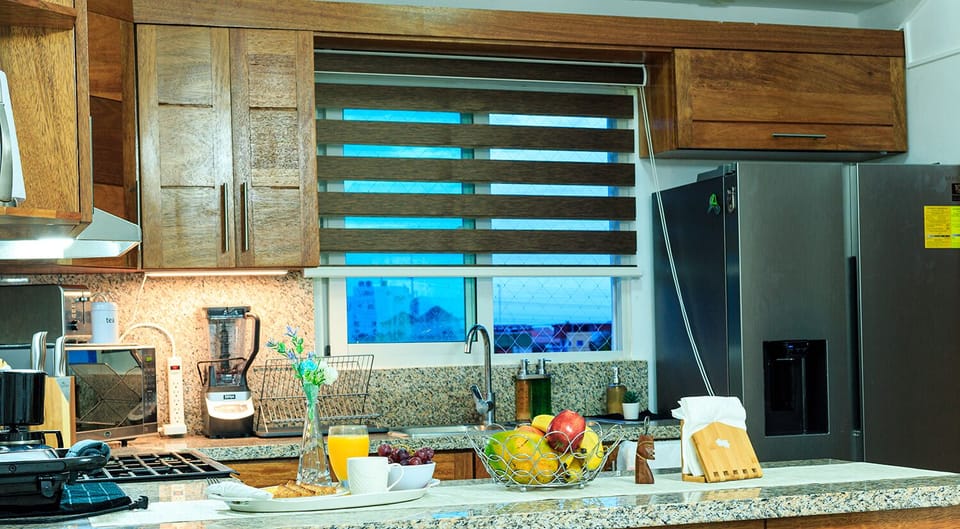 Kitchen with; Microwave, blender, Dispenser water, toaster, fridge, coffee maker