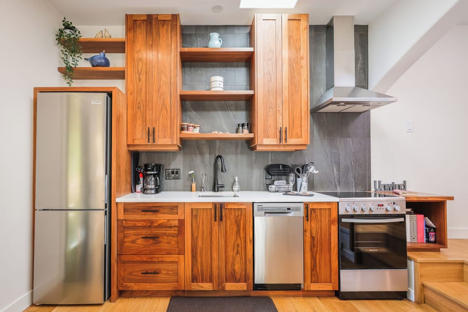 The custom kitchen has open storage for any groceries you tend on enjoying.