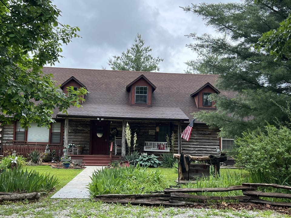 Natural Oak Log Cabin in woods 