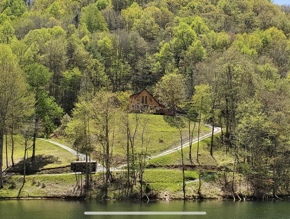 This pic of the cabin was taken from a kayak in the lake, May 2023
